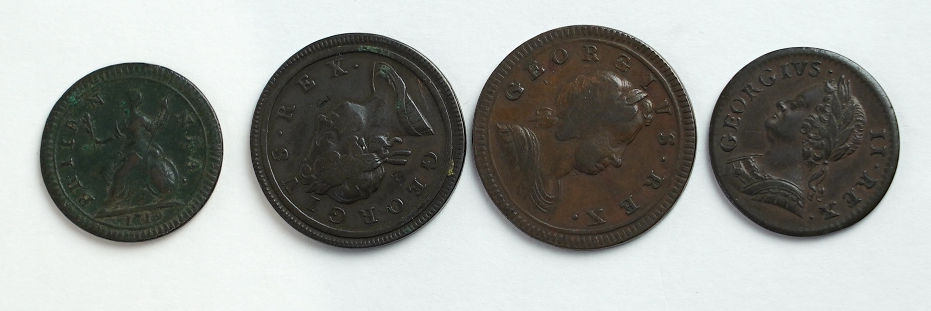 British farthings and halfpennies, Georgian period; two George I halfpenny coins, 1717, graffiti initials each side of portrait bust otherwise fine and 1723, about fine, three George I farthings, including 1719, fine, tw